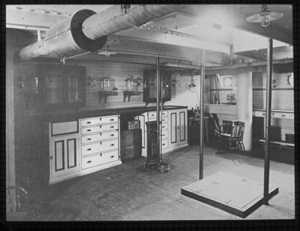 Image of Interior of a vessel, cabinets, work desk